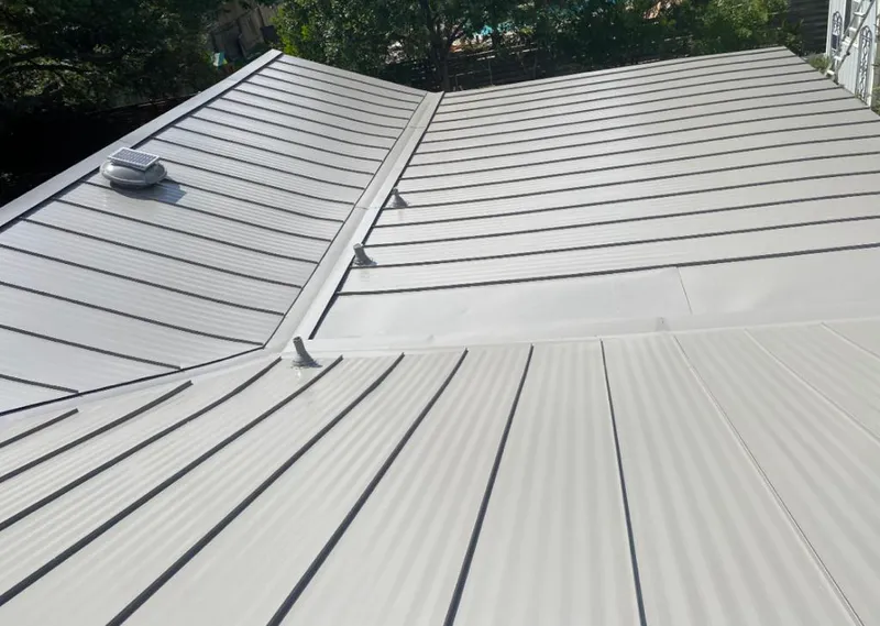 Solar attic fan installed on a metal roof for Roof Ventilation in Abilene